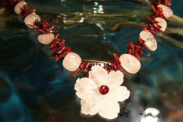 Rose Quartz Flower among Burgundy Coral Thorns