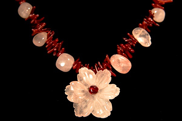 Rose Quartz Flower among Burgundy Coral Thorns